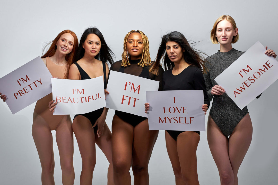 inclusive fashion for women empowering diverse women holding body-positive signs for self-love and confidence