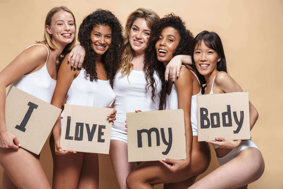 tummy control shapewear for confident women posing in white lingerie with body-positive signs
