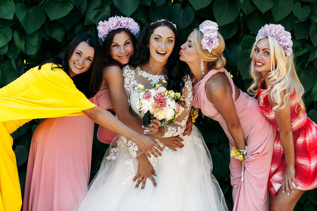 one piece bodysuit for weddings bridal party with elegant bridesmaids celebrating a joyful wedding portrait