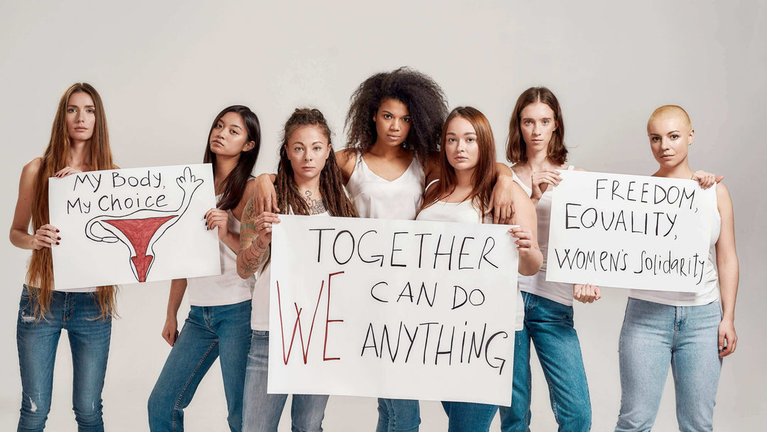 women's rights and body positivity: diverse women holding protest signs for freedom, equality, and women's solidarity