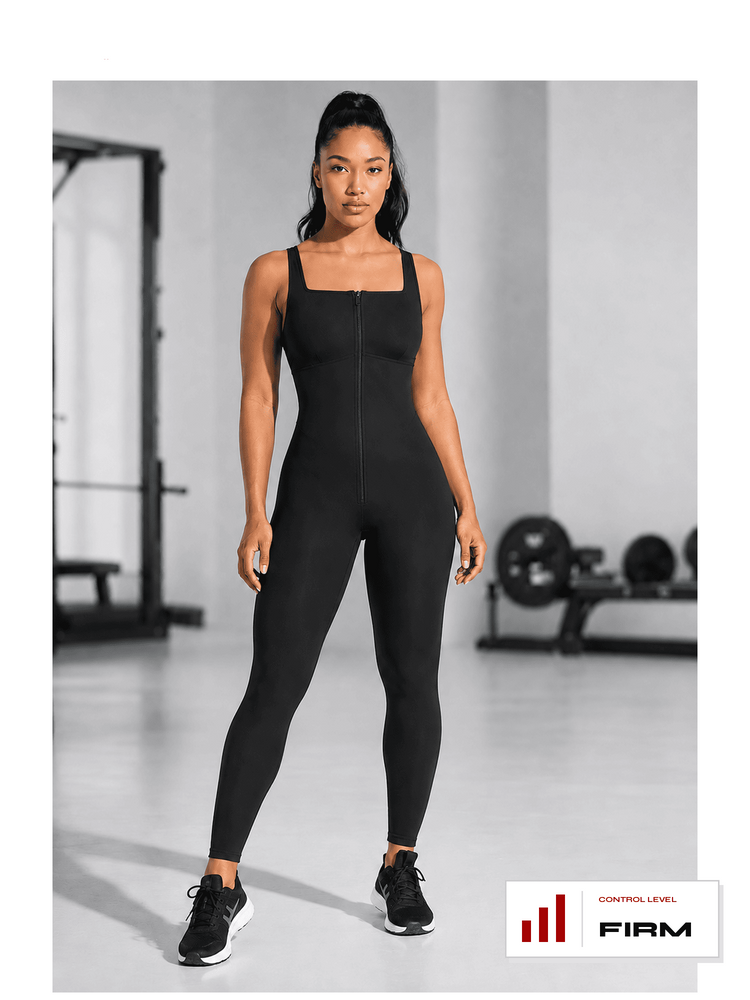 A woman stands in a gym wearing a black sleeveless zip-front bodysuit with a square neckline and full-length legs. The image includes text reading 'SUGAR + SPICY' and 'IBAIUNA PERFORMANCE' at the top left, and a 'FIRM' performance badge at the bottom right.