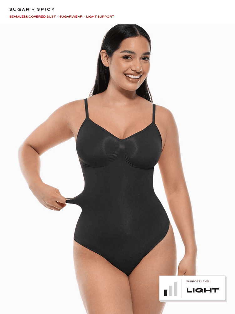 A woman modeling a black seamless shapewear bodysuit against a white background, with text overlays reading 'SUGAR + SPICY' and 'LIGHT SUPPORT' at the top and a 'LIGHT SUPPORT LEVEL' badge at the bottom right.