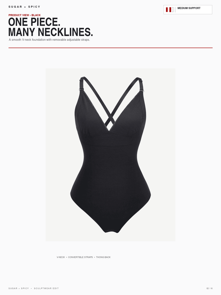 A black one-piece swimsuit with a deep V-neckline and crisscross strap detail at the shoulders, shown on a light gray background within a catalog layout.