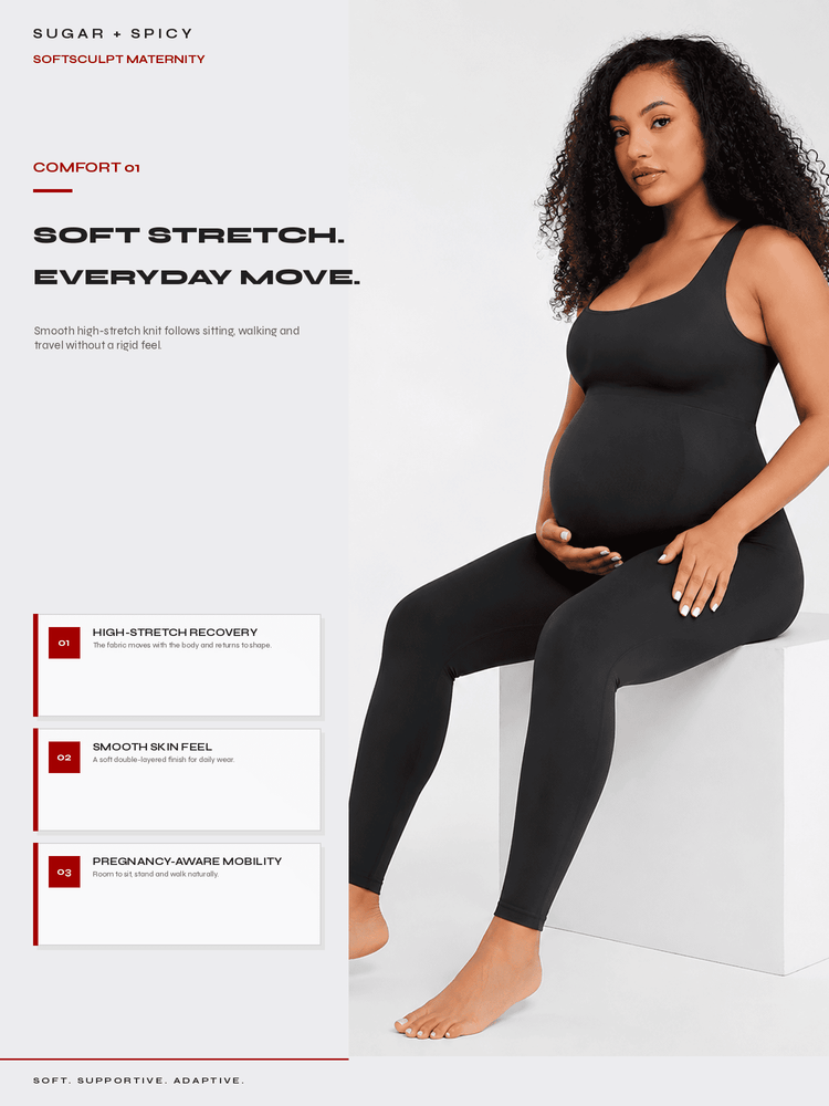 A pregnant model wearing a black maternity tank top and matching leggings sits on a white block against a light gray background. The left side features product text and feature callouts for a 'Sugar + Spicy' softsculpt maternity outfit.
