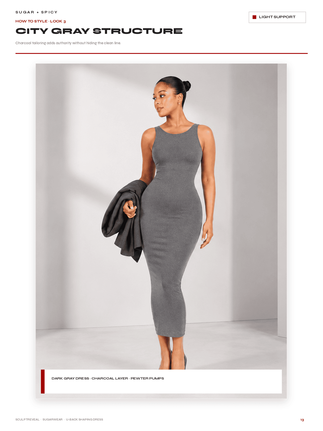 A model wearing a fitted sleeveless gray midi dress, styled with a dark gray jacket draped over one arm, set against a clean light gray studio background. The image is presented as a catalog page titled &