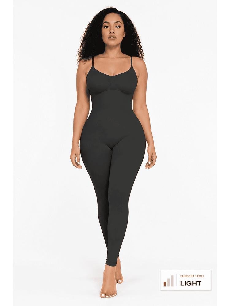 A woman modeling a dark charcoal gray seamless bodysuit with thin spaghetti straps and a scoop neckline, standing against a plain white studio background. A small overlay in the bottom right corner reads 'SUPPLY LEVEL LIGHT'.