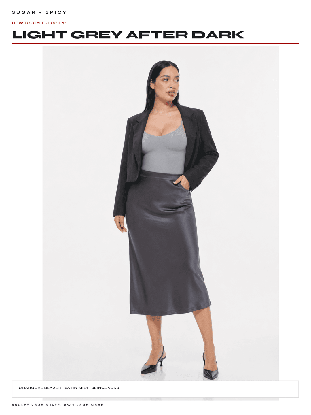 A model is shown wearing a charcoal grey satin midi skirt, a black blazer, and a grey camisole against a white studio background. Text overlays at the top and bottom describe the color story as &