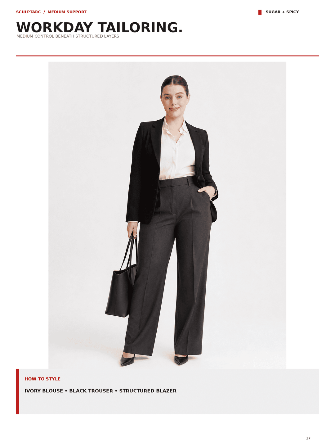 A model stands against a light gray studio background wearing a black structured blazer over an ivory blouse with dark wide-leg trousers, holding a black tote bag. The page includes the text &