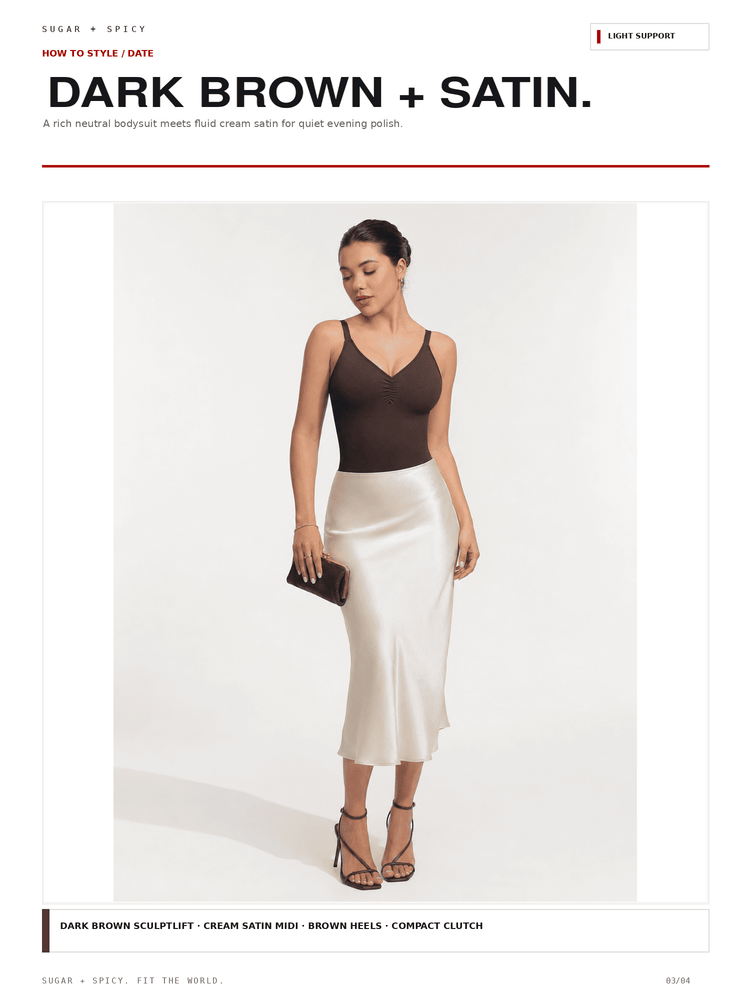 A fashion editorial page showing a model wearing a dark brown sleeveless top and a cream satin midi skirt, holding a small dark clutch. The page header reads 'DARK BROWN + SATIN.