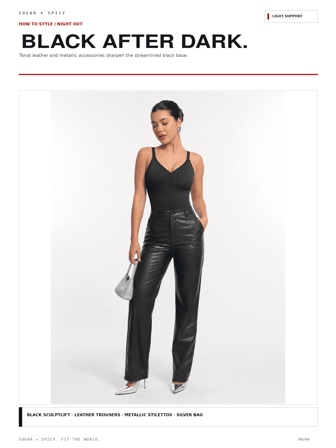 A model wears a black sleeveless camisole and shiny black leather-look trousers with silver pointed heels and a small silver handbag, set against a clean white studio background with editorial text at the top and bottom.
