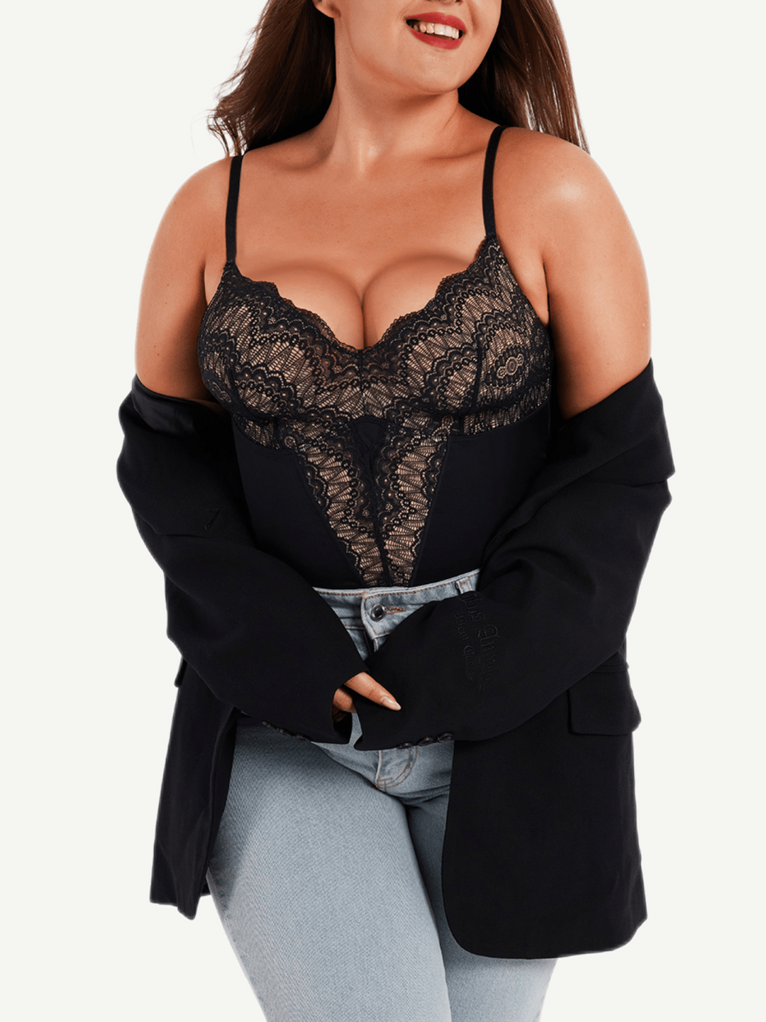 Woman wearing a black lace top and black cardigan on a white background