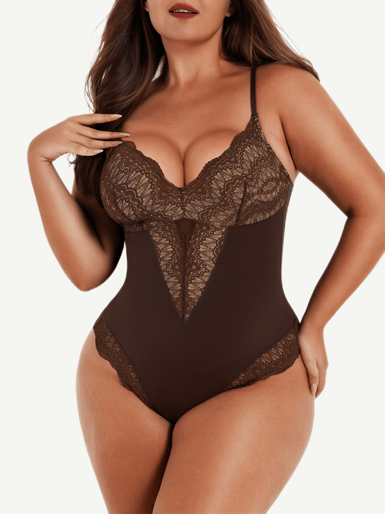 Woman wearing a brown lace bodysuit on a white background