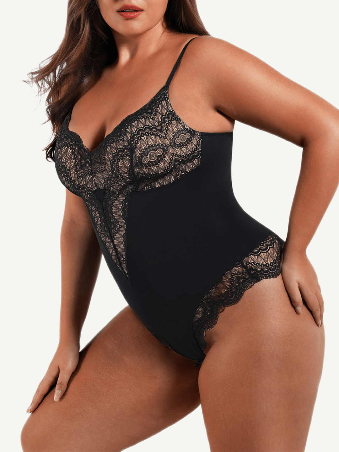 Black lace bodysuit worn by a model on a white background