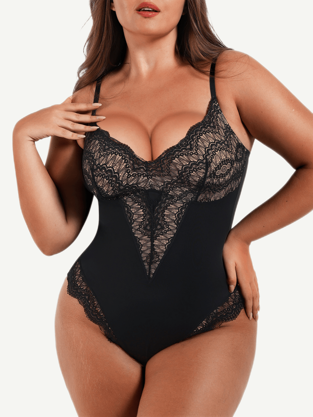 Black lace bodysuit worn by a model on a white background