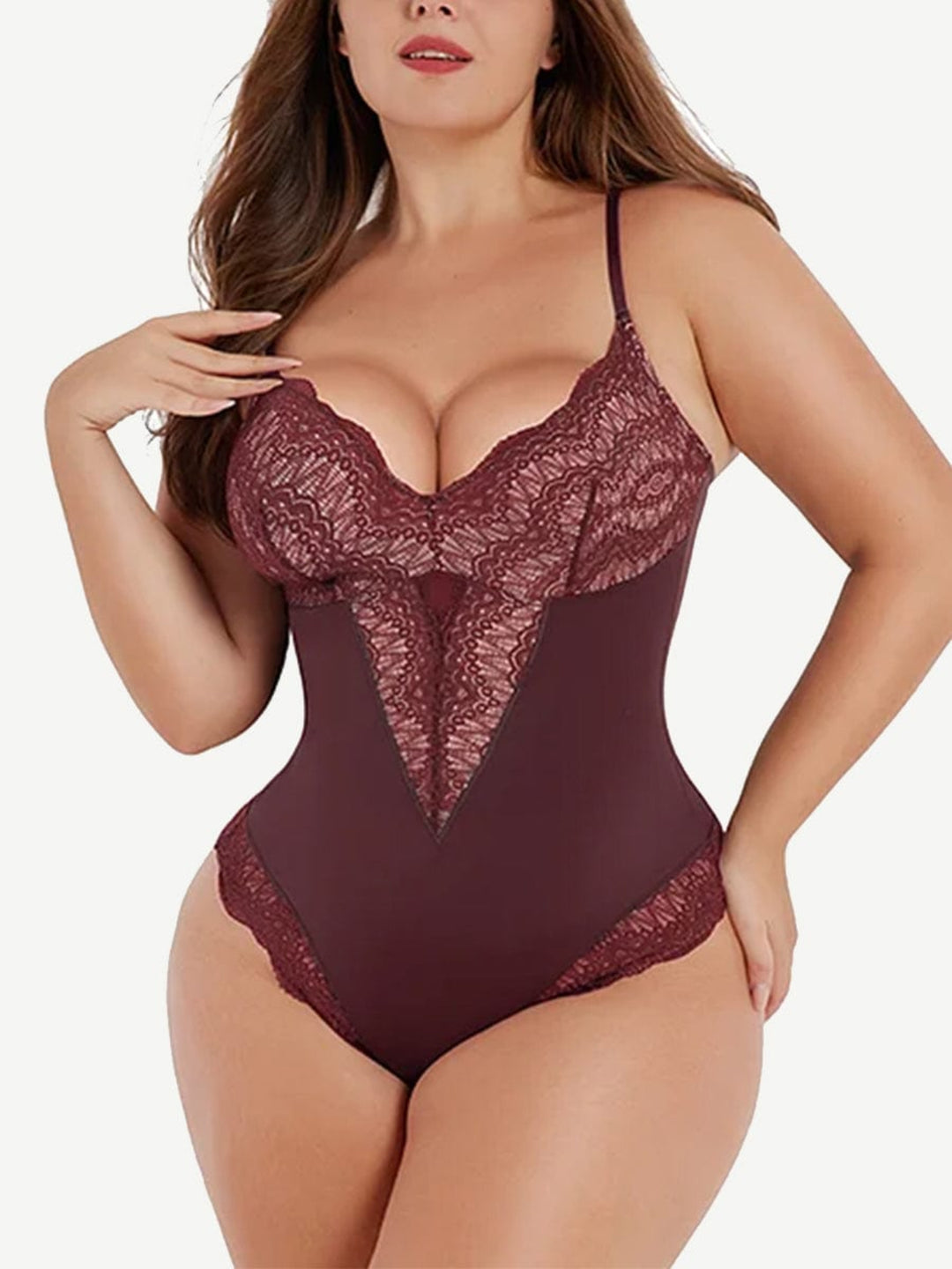 Lace bodysuit worn by a model on a white background