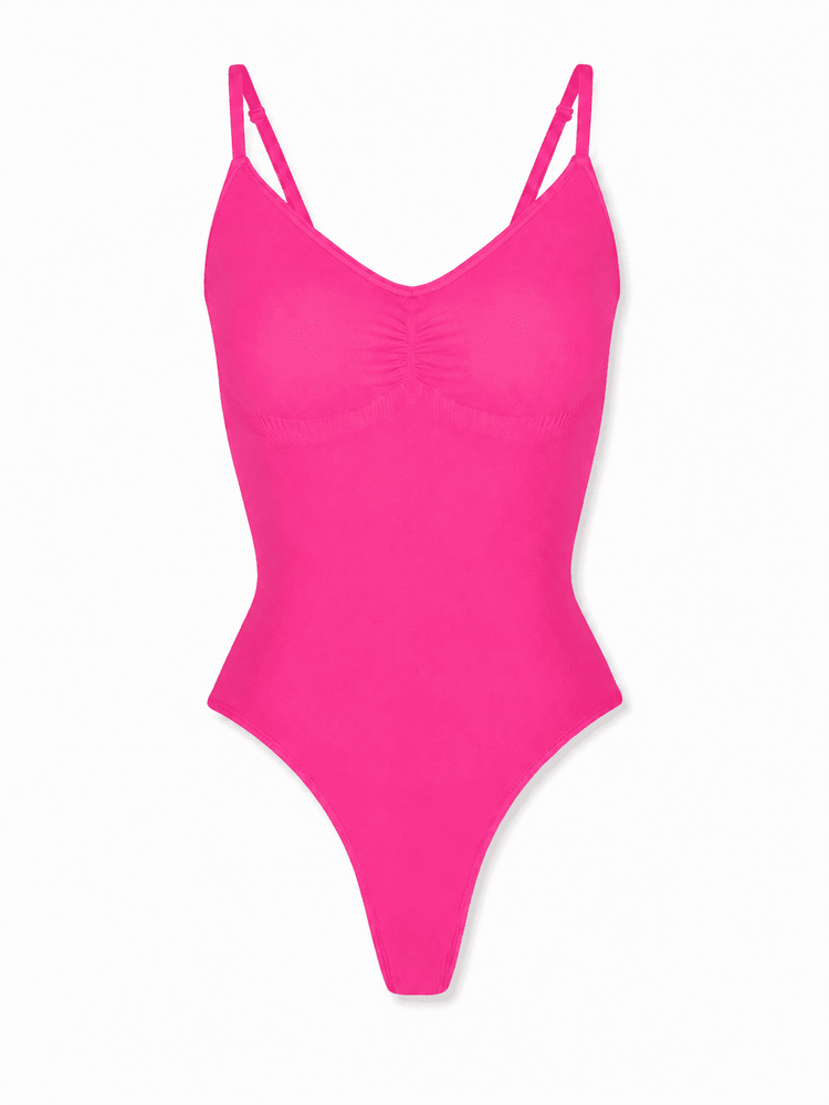 A bright hot pink one-piece swimsuit with thin double shoulder straps and a ruched bust detail, shown against a plain white background.