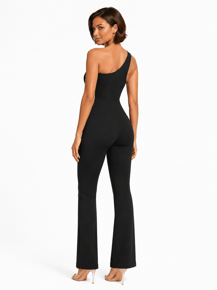 A woman modeling a black one-shoulder flared jumpsuit, shown from a rear three-quarter angle against a plain white studio background.