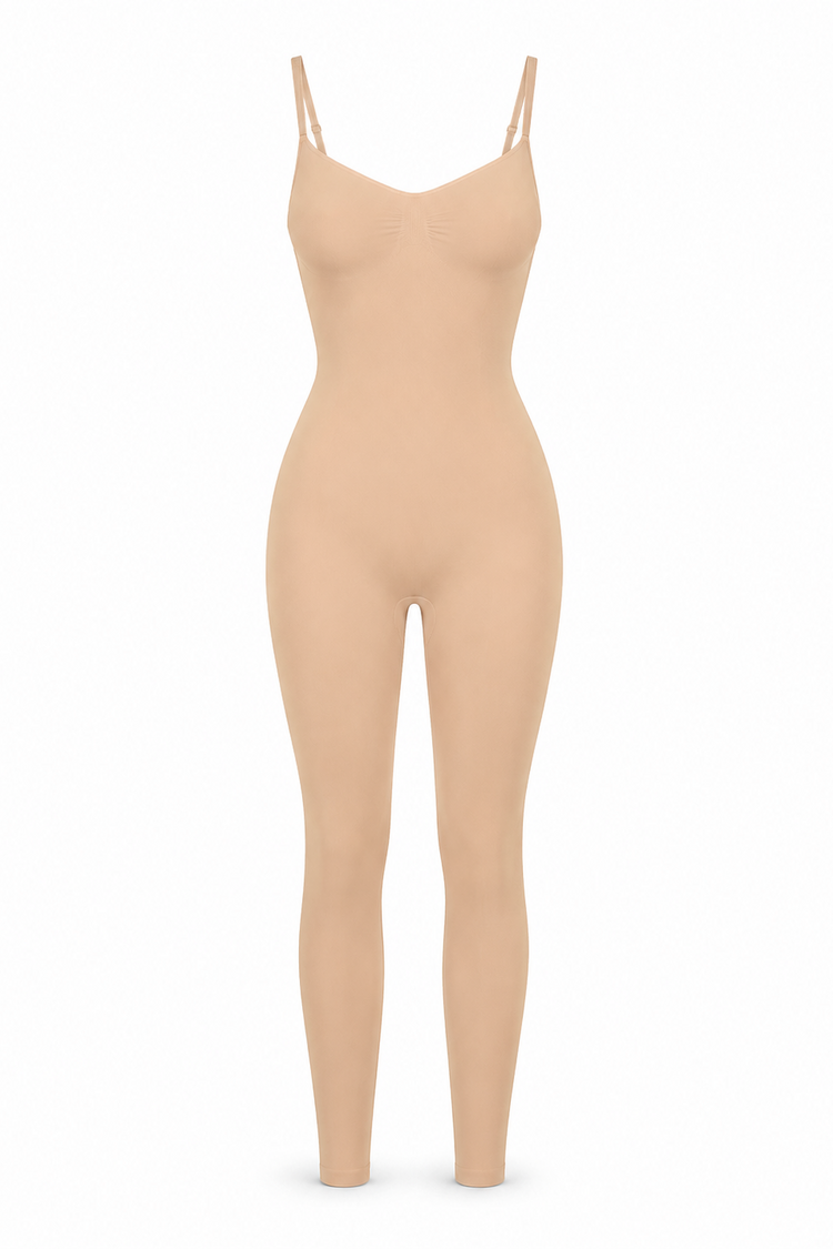 A full-body beige shapewear bodysuit or compression garment with thin shoulder straps, shown on a plain white background.