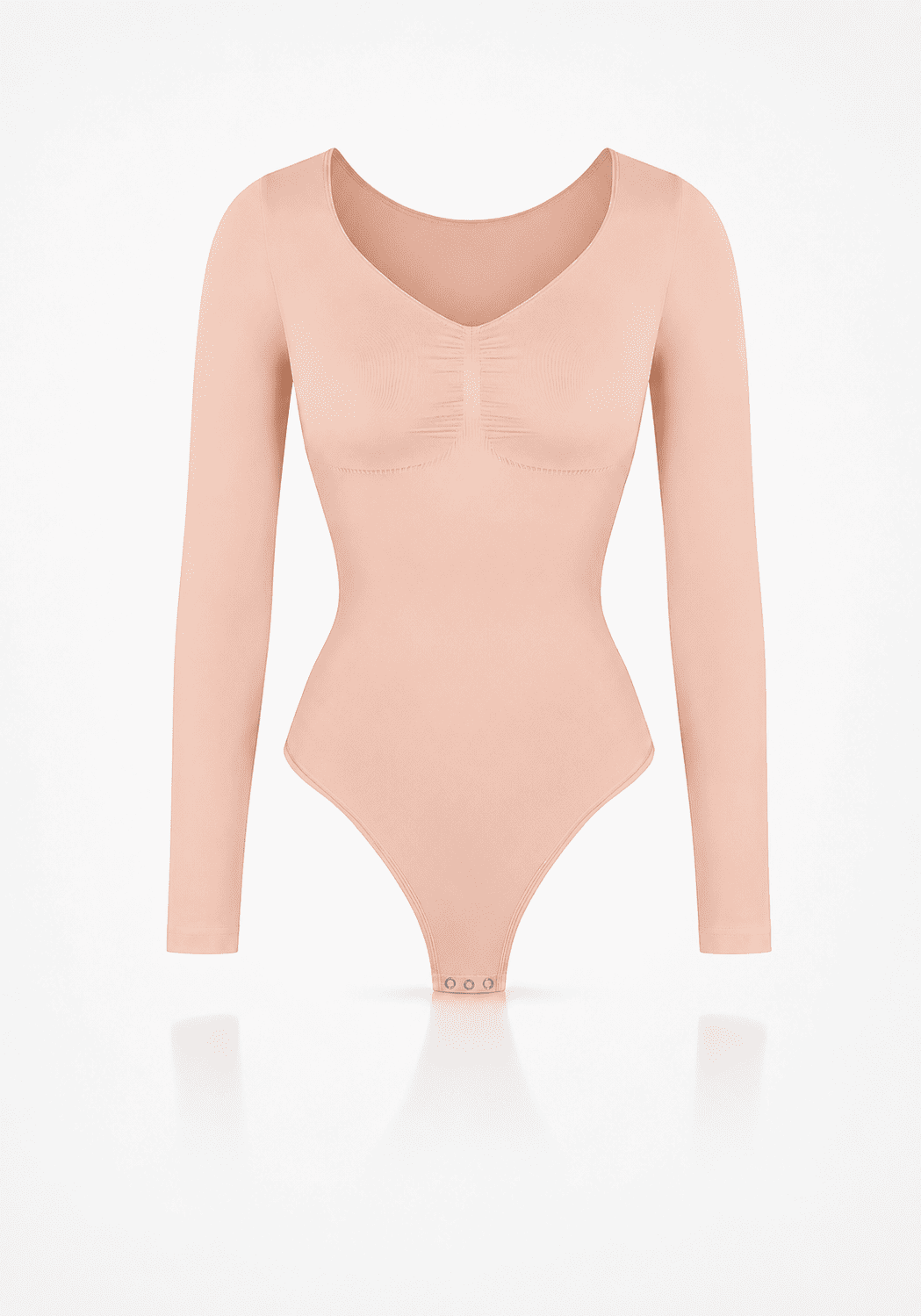 Sculpting long sleeve bodysuit in soft peach color with seamless design and light compression.