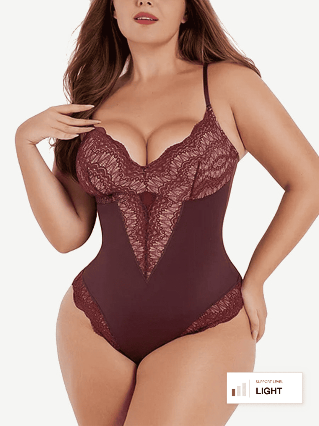 A plus-size model wearing a light brown lace and satin bodysuit with thin straps, photographed against a plain white background. A small label in the bottom right corner reads 'LIGHT'.