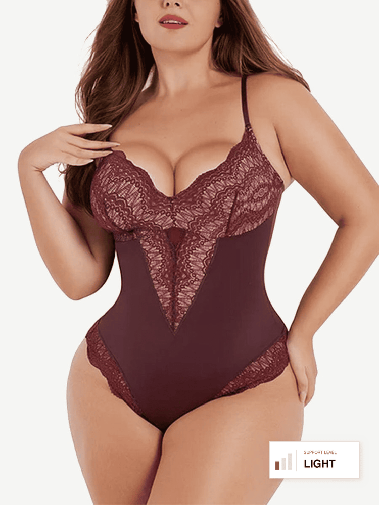 A plus-size model wearing a light brown lace and satin bodysuit with thin straps, photographed against a plain white background. A small label in the bottom right corner reads 'LIGHT'.