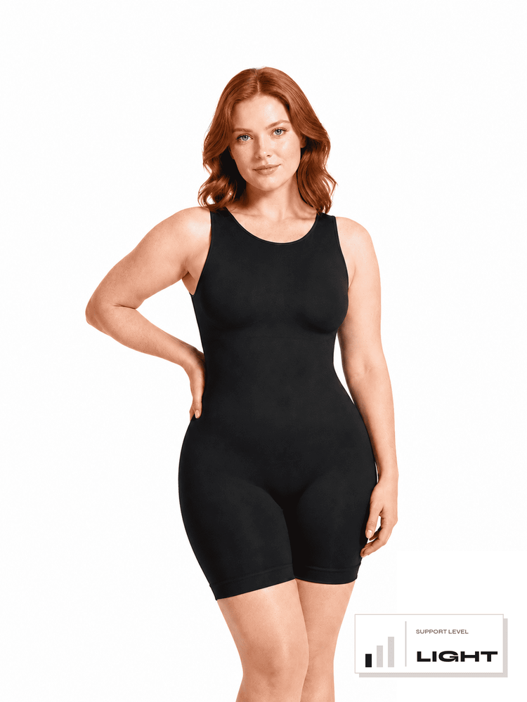 A woman modeling a black sleeveless compression bodysuit with built-in shorts, shown against a plain white background with a 'Support Level Light' badge in the bottom right corner.