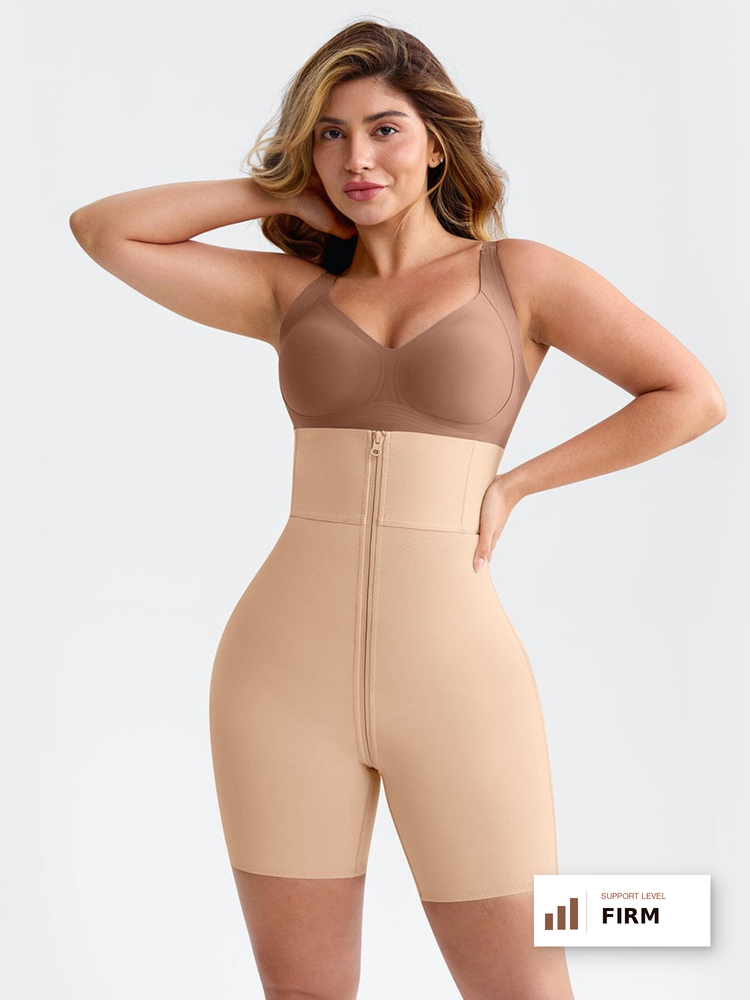 A woman modeling a beige compression shapewear bodysuit with a front zipper, shown against a light gray studio background. A small badge in the bottom right corner reads 'SUPPORT LEVEL FIRM'.