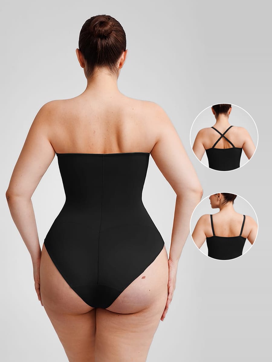 Black strapless bodysuit worn by a model on a gray background
