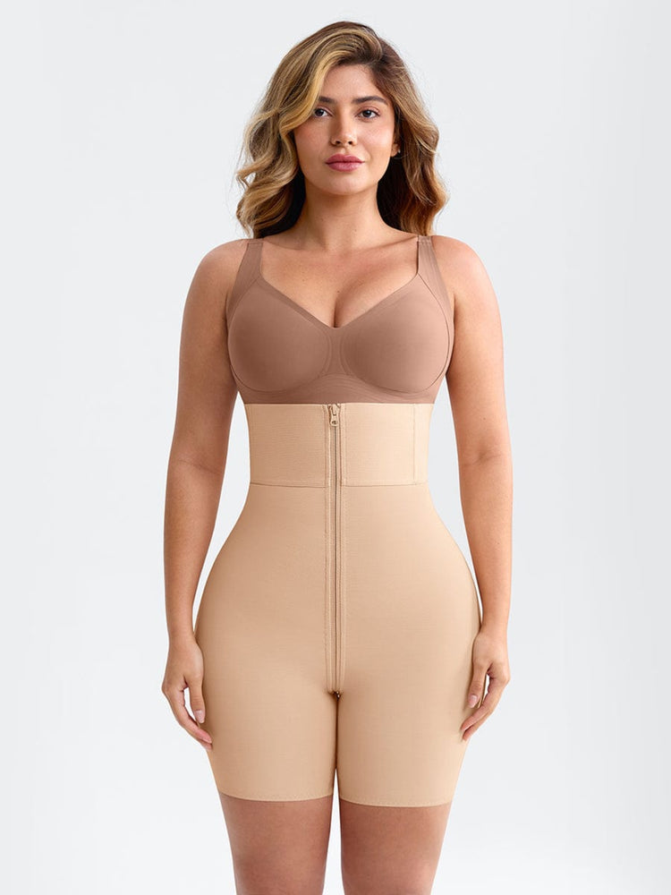 Woman wearing a beige shapewear jumpsuit on a light gray background