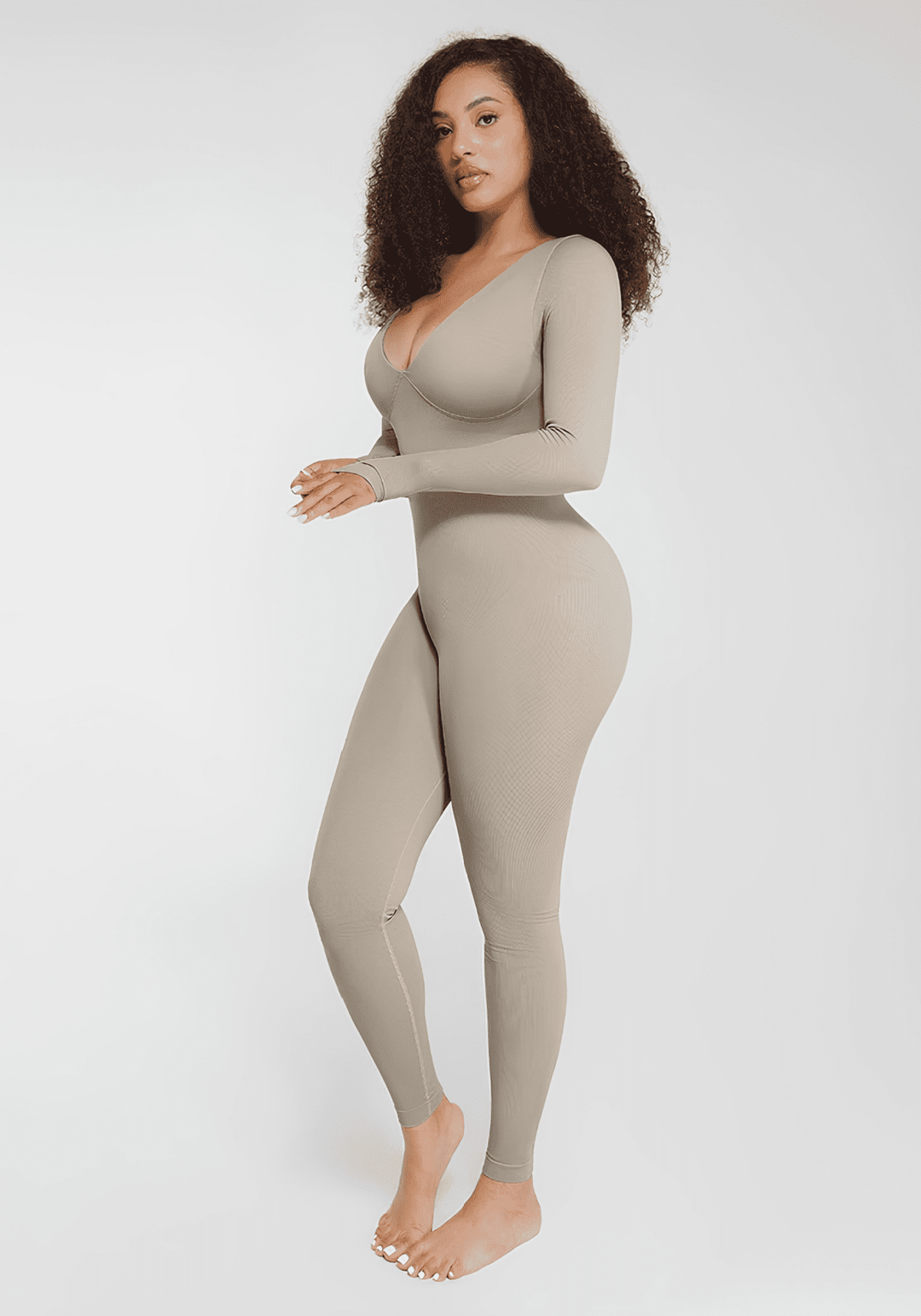 deep v tummy control catsuit shaping jumpsuit with deep V-neck, long sleeves, and smooth sculpted fit