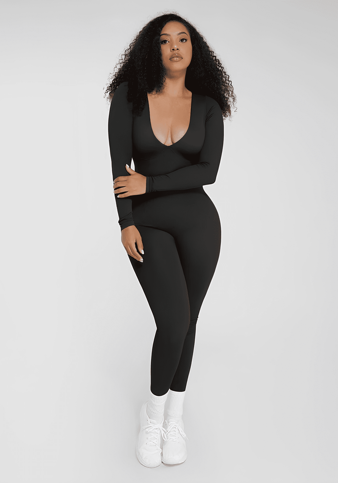deep v tummy control catsuit black shapewear with deep V-neck, long sleeves, and sculpting fit