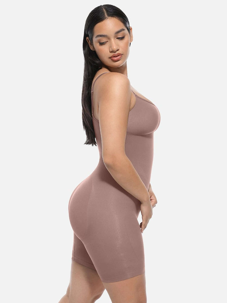 Full body shaper bodysuit in mid-thigh length with light compression, waist and tummy control, and butt-lifting pockets.