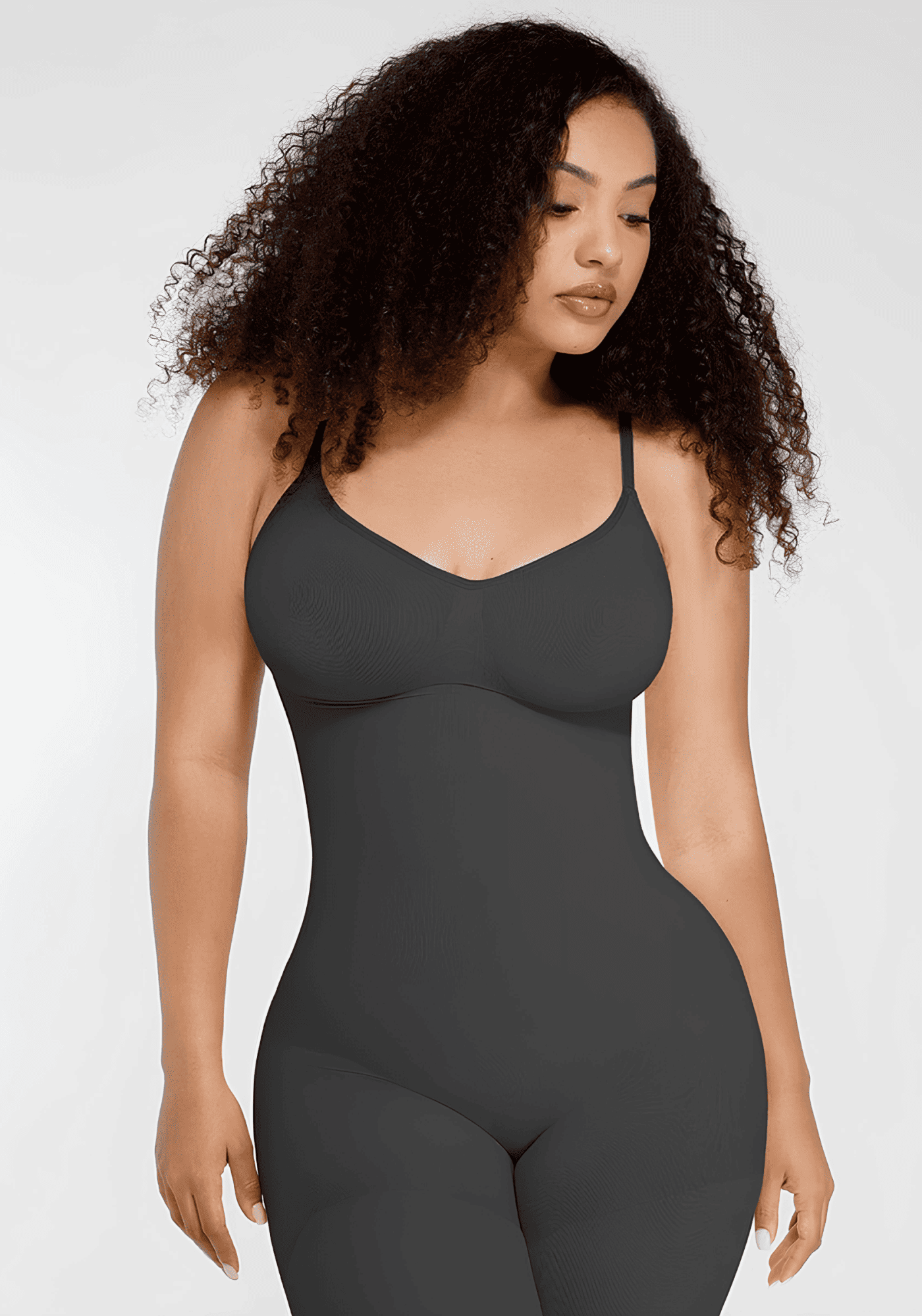 Full-length body shaper catsuit with seamless support, adjustable straps, and curve-smoothing fit