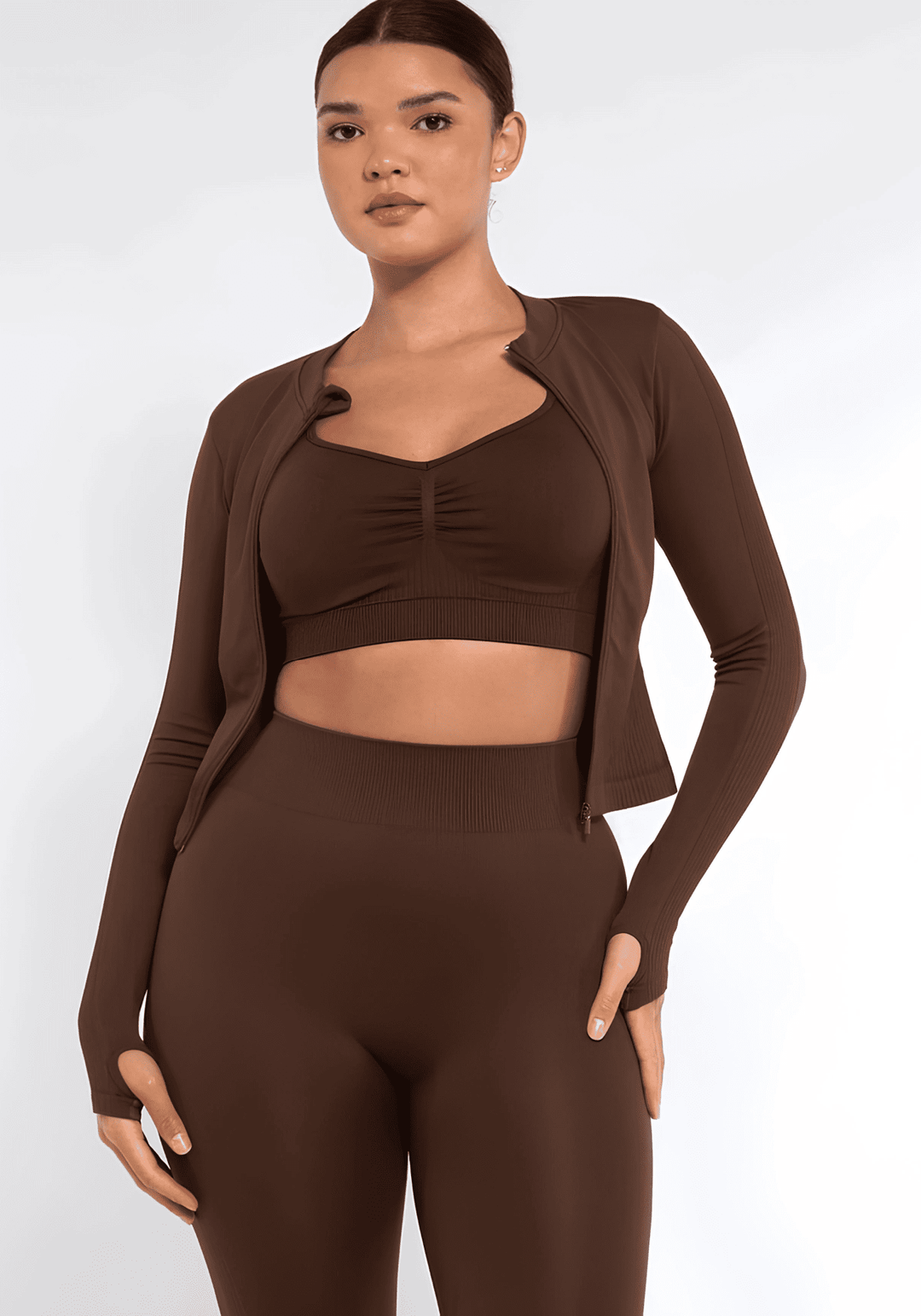 full zip running top with thumb hole technology, seamless fit, long sleeves, and flattering compression design