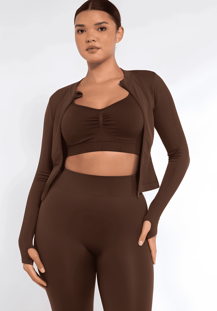 full zip running top with thumb hole technology, seamless fit, long sleeves, and flattering compression design