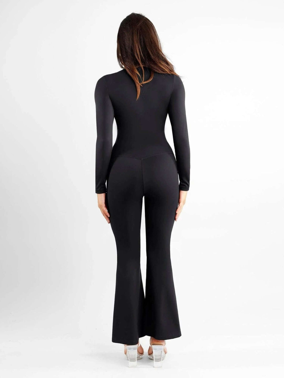high-waisted front slit leggings in black, back view, slim fit activewear with flattering flared leg and body-shaping waist