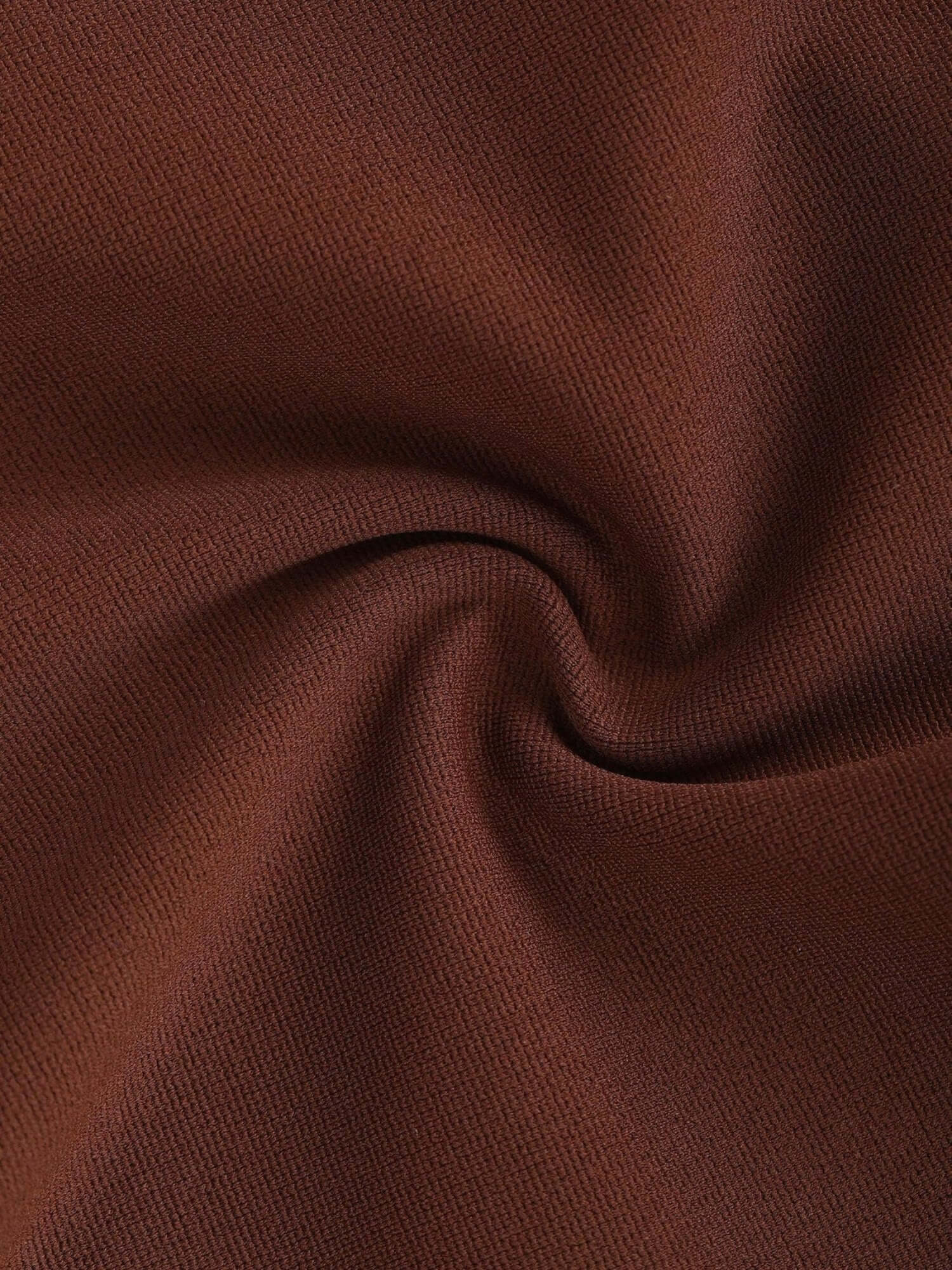 Brown fabric close-up for high-waisted front slit leggings, showcasing soft breathable Roman cloth texture.