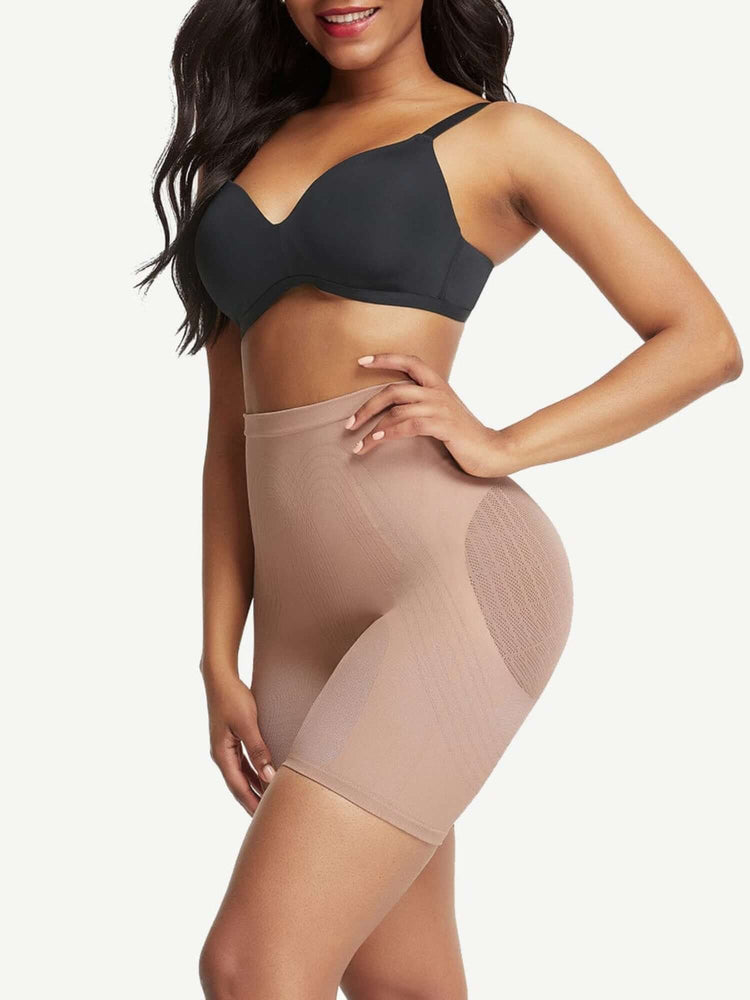 Model wearing high waisted shapewear shorts with tummy control, butt-lifting support, and breathable mid-thigh compression fit