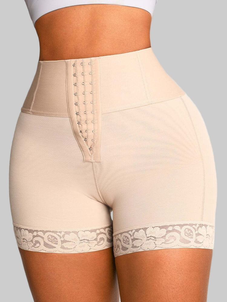 High-waisted shaping shorts with lace trim and tummy control, seamless support, and smoothing fit for all-day comfort.