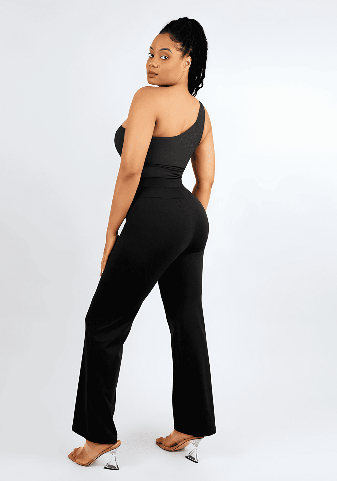 high-waisted straight leg pants with sculpting fit, built-in shaping shorts, and sleek black finish on model