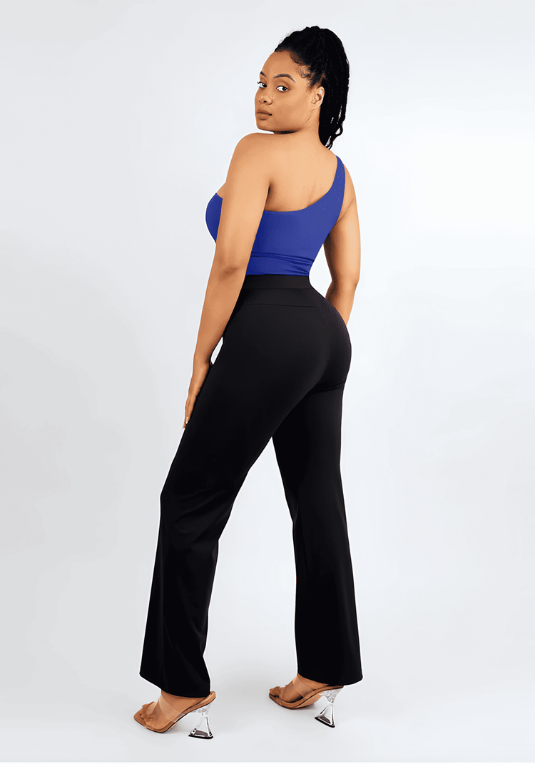 Model wearing high-waisted straight leg pants with a blue top, showcasing a sculpting high-rise fit and streamlined silhouette
