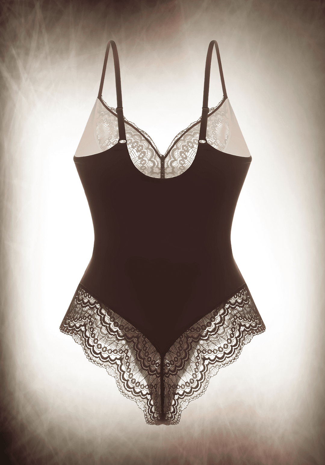 Elegant lace bodysuit with lace panelling, low-back styling, and slimming tummy cutout for a flattering fit