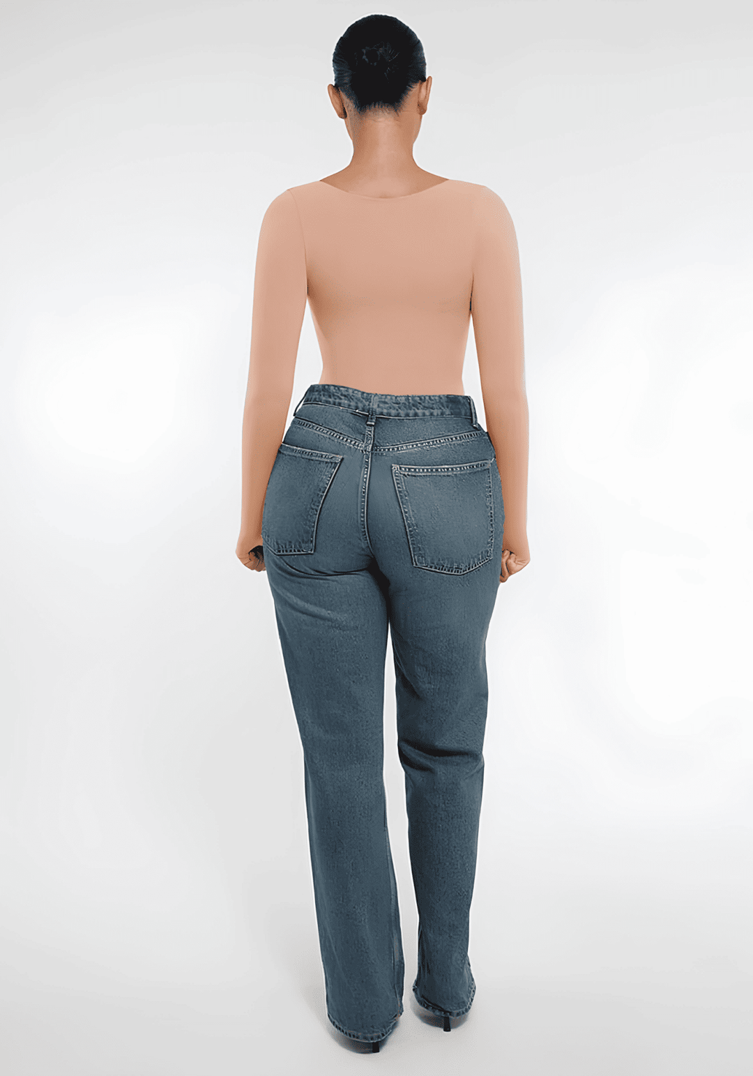 long sleeve sculpting bodysuit worn with jeans, back view, seamless shaping top for smooth everyday layering