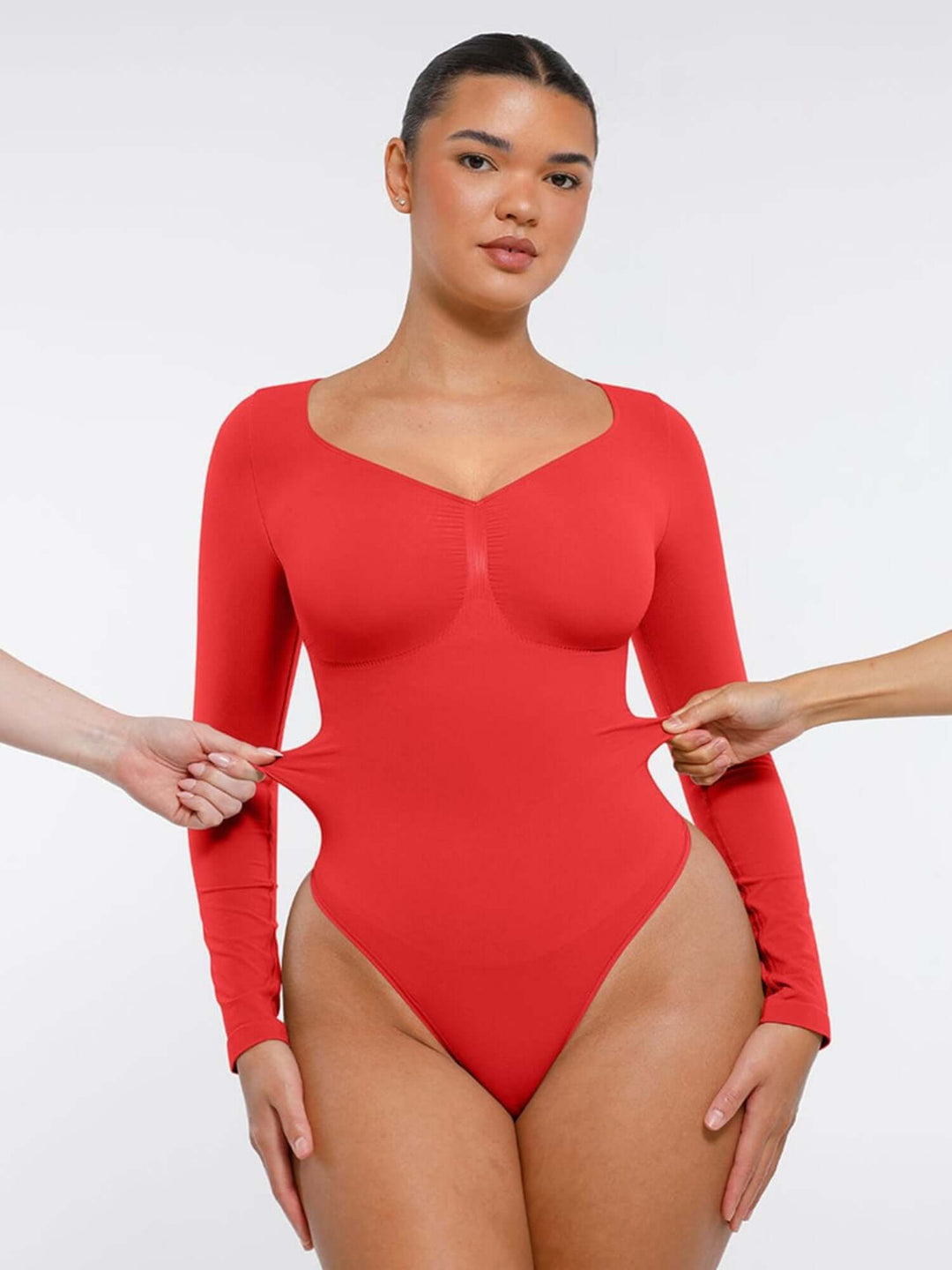 long sleeve sculpting bodysuit in red with seamless shapewear fit for waist shaping, layering, and all-day comfort