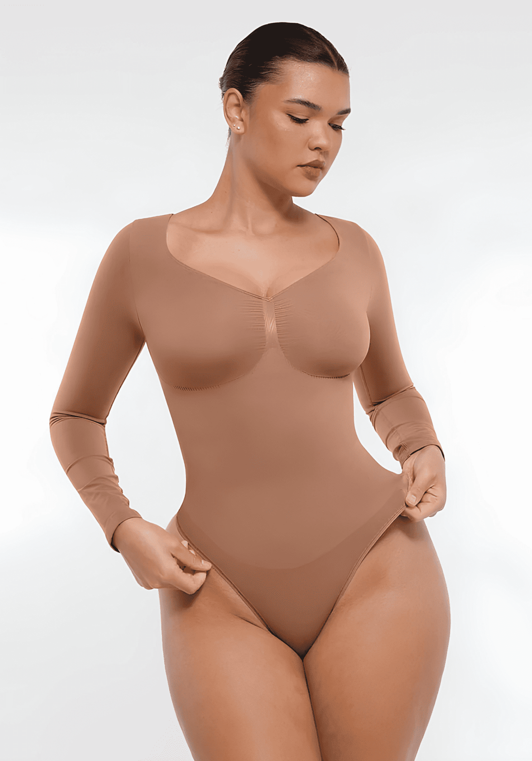 long sleeve sculpting bodysuit with smooth seamless fit, waist shaping support, and long-sleeve silhouette for layering