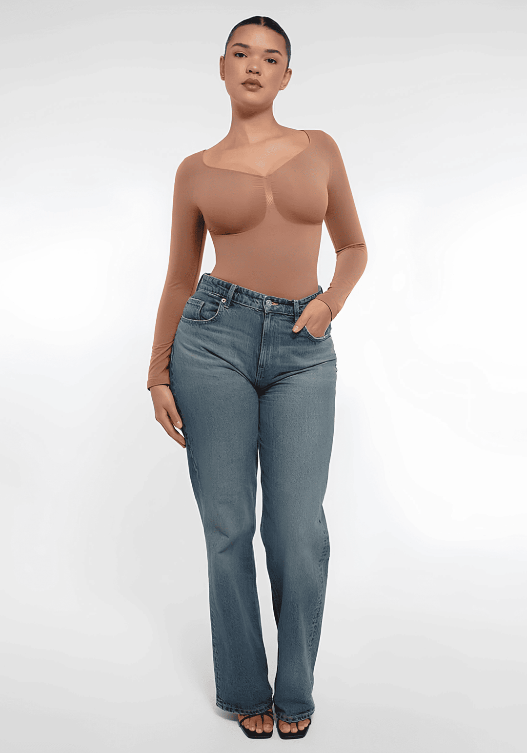 long sleeve sculpting bodysuit with seamless fit and sculpting silhouette, styled with jeans for everyday comfort