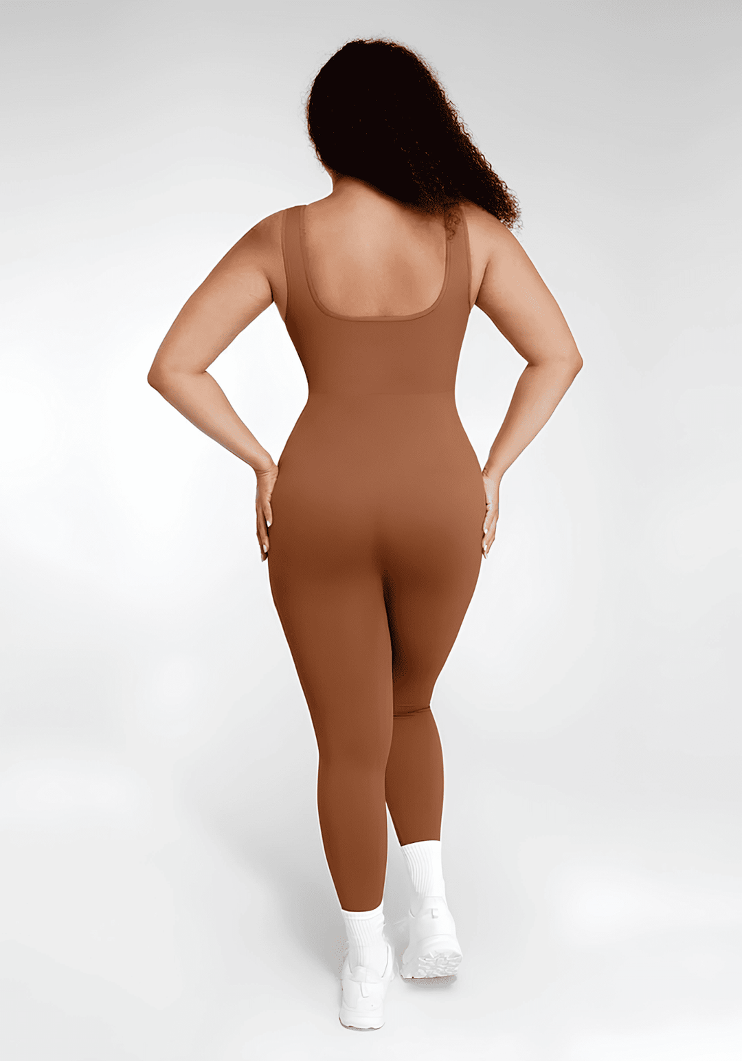 Maternity catsuit in brown, back view with square neck and tank straps, designed for a flattering second-skin fit