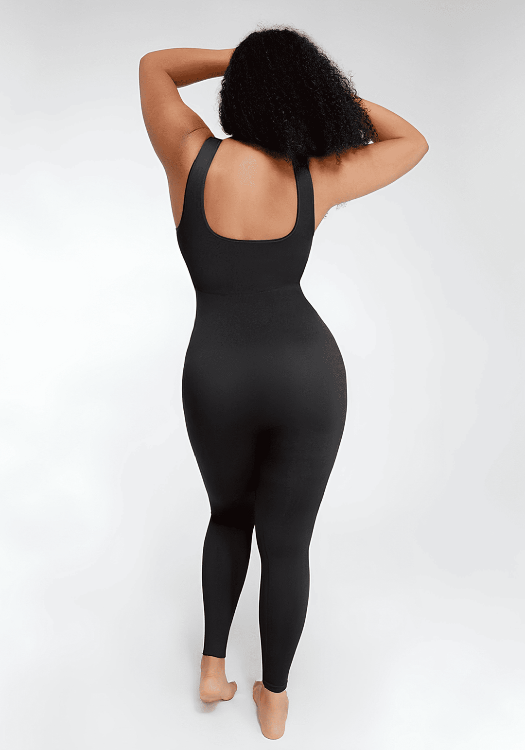 Black maternity catsuit with square back and tank straps, full-length fitted one-piece with second-skin stretch