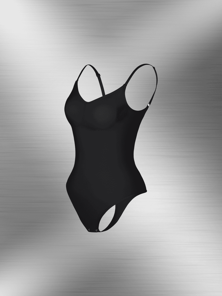 Black open-back bodysuit with adjustable straps, low scoop back, and snap closure for seamless support under clothing.