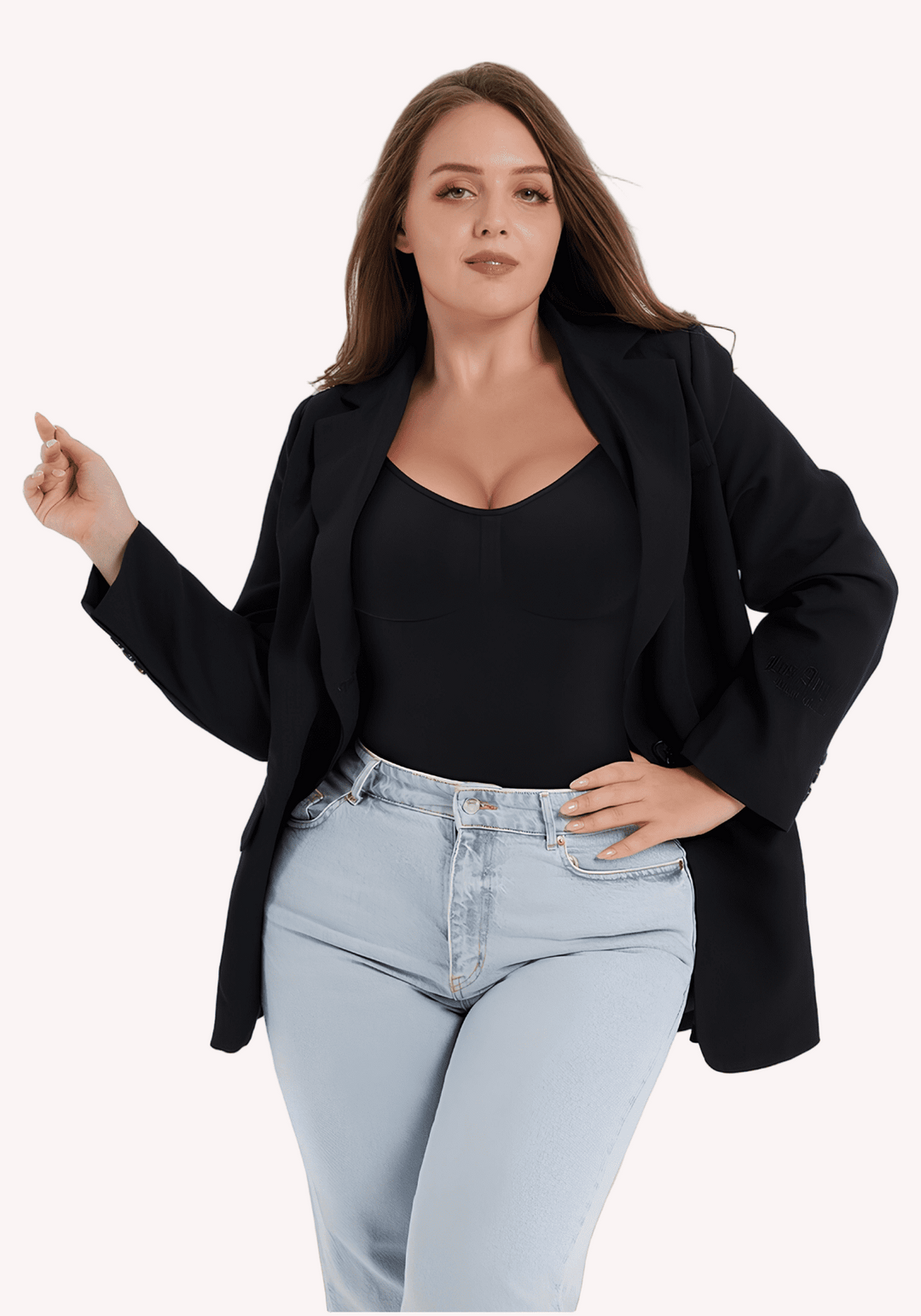 open-back bodysuit with low scoop back and adjustable straps, styled under a black blazer and jeans